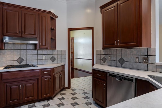 kitchen featuring stainless steel dishwasher, light countertops, gas stovetop, and under cabinet range hood