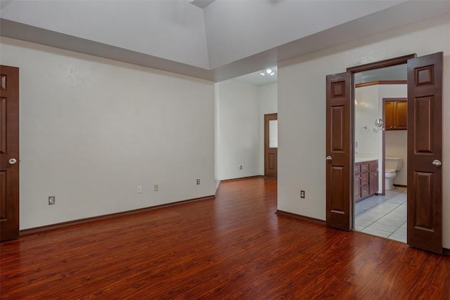 unfurnished room with baseboards and light wood finished floors