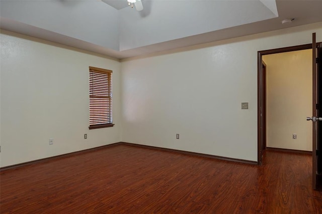 unfurnished room featuring baseboards, ceiling fan, and wood finished floors