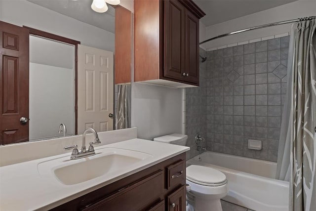 full bath featuring toilet, shower / bath combo with shower curtain, and vanity