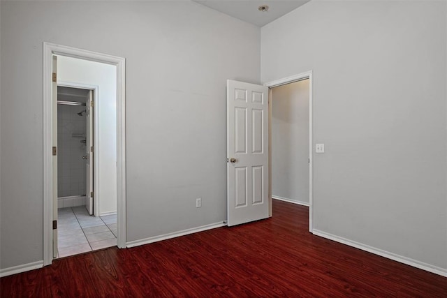 unfurnished bedroom featuring baseboards and wood finished floors