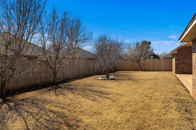 view of yard with a fenced backyard