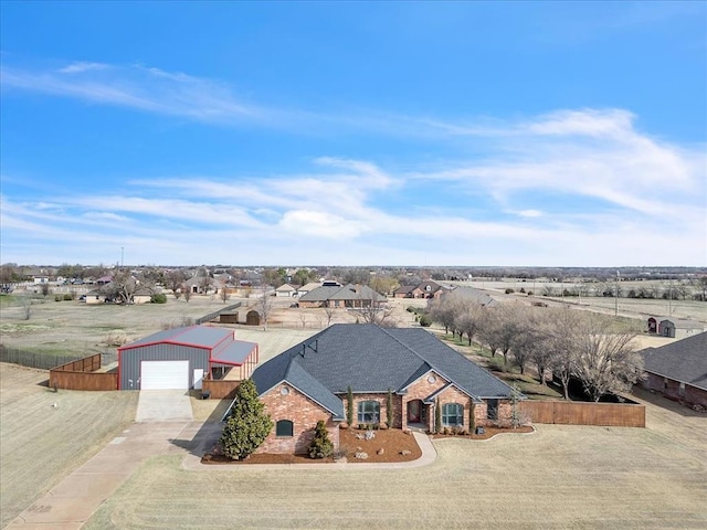 birds eye view of property with a residential view