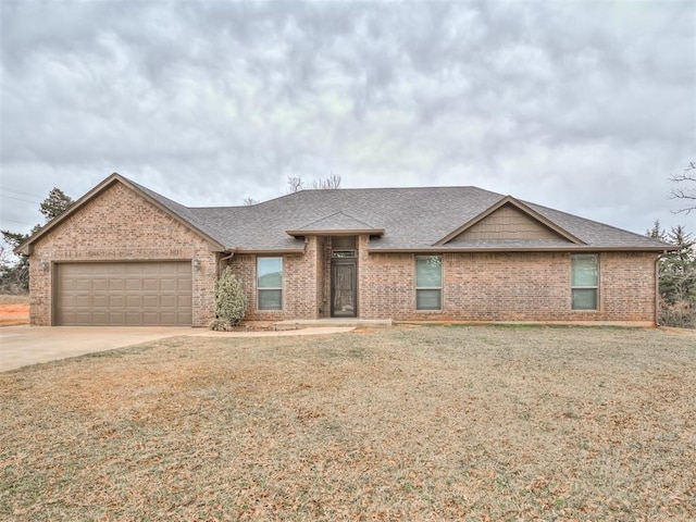 view of front of property with an attached garage, brick siding, driveway, and roof with shingles