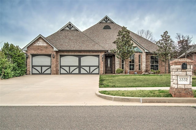 view of front of home with brick siding, driveway, and roof with shingles