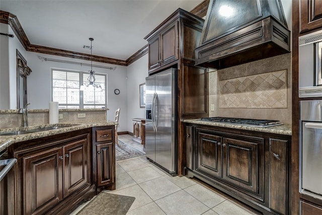 kitchen with a sink, stainless steel appliances, crown molding, and custom range hood