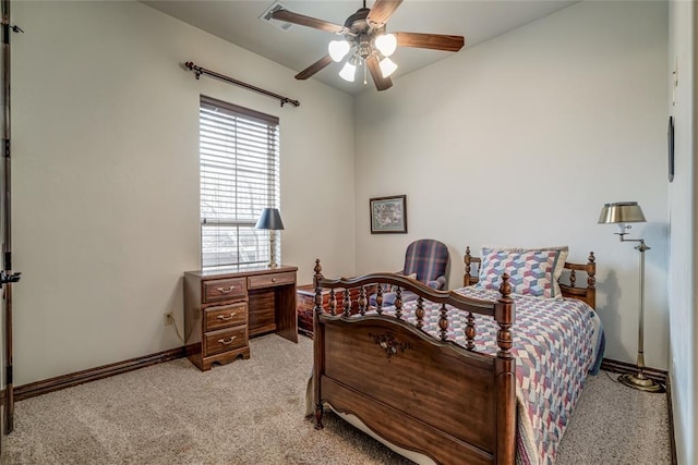 bedroom featuring ceiling fan, baseboards, and light carpet