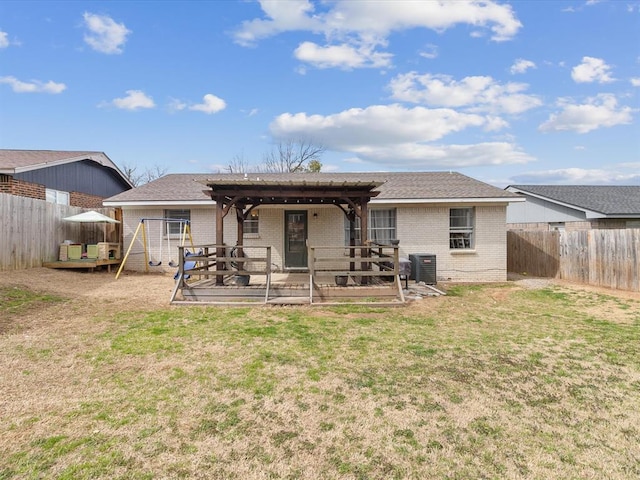 back of property featuring cooling unit, a wooden deck, a fenced backyard, and brick siding