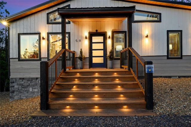 exterior entry at dusk featuring crawl space