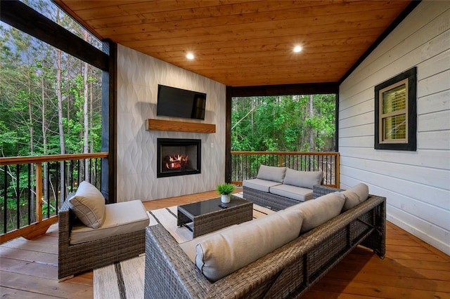 wooden deck with an outdoor hangout area