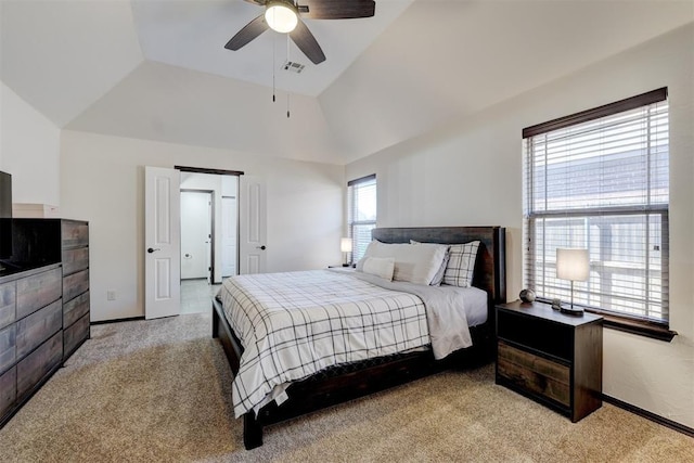 bedroom with visible vents, lofted ceiling, light colored carpet, and baseboards