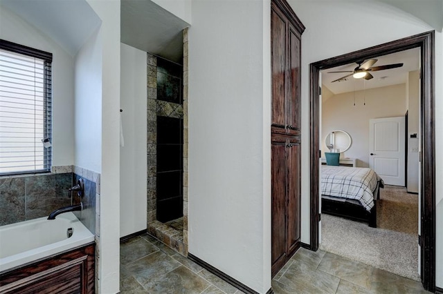 ensuite bathroom featuring ceiling fan, a garden tub, ensuite bath, and a tile shower