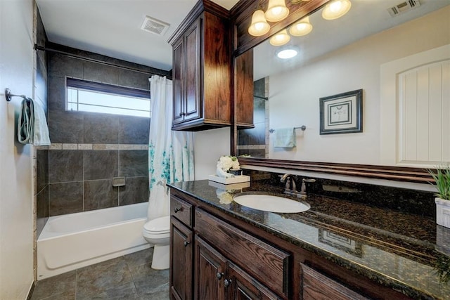 full bath featuring visible vents, toilet, vanity, and shower / bath combo