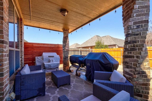 view of patio featuring area for grilling and a fenced backyard