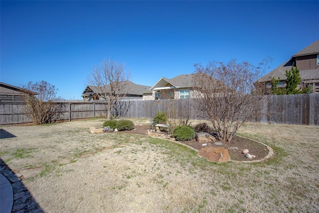 view of yard featuring a fenced backyard