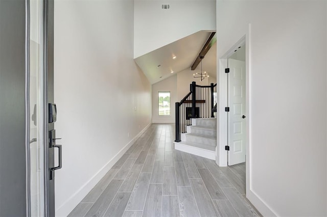 8101 Jenny Ln, Edmond, OK 73034 - hall with stairs, light wood finished floors, baseboards, high vaulted ceiling, and beamed ceiling