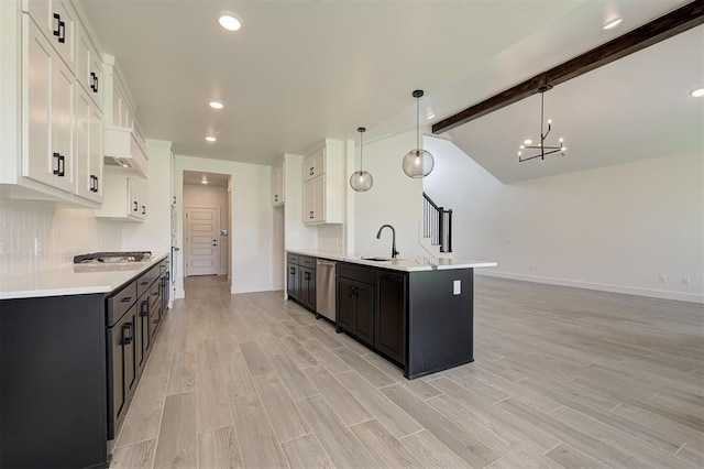 8101 Jenny Ln, Edmond, OK 73034 - kitchen with appliances with stainless steel finishes, a sink, baseboards, light countertops, and recessed lighting