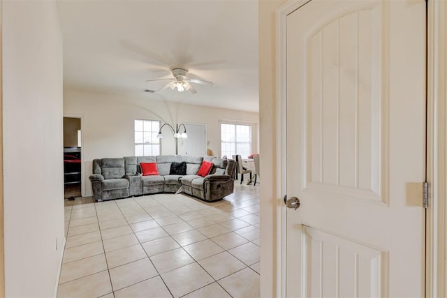 636 NW 112th St, Oklahoma City, OK 73114 - living area featuring light tile patterned floors, visible vents, and a ceiling fan