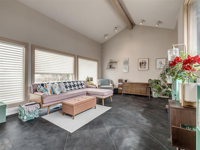 living room with beam ceiling and high vaulted ceiling