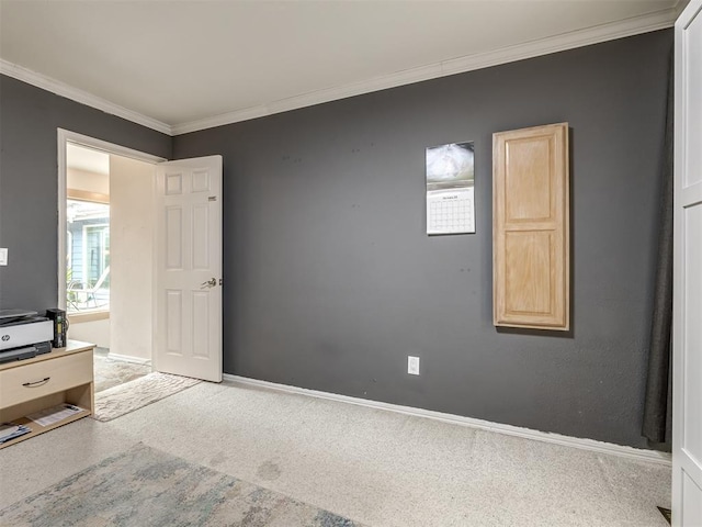 unfurnished bedroom with baseboards, carpet floors, and ornamental molding