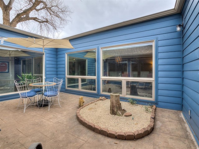 view of patio featuring outdoor dining area