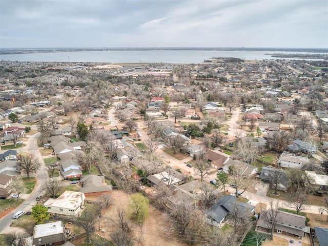 drone / aerial view with a residential view and a water view