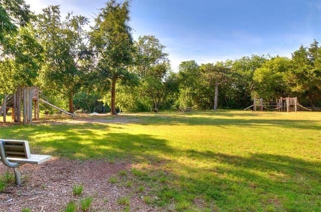 view of community featuring a lawn and playground community