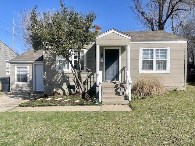 bungalow with a front yard