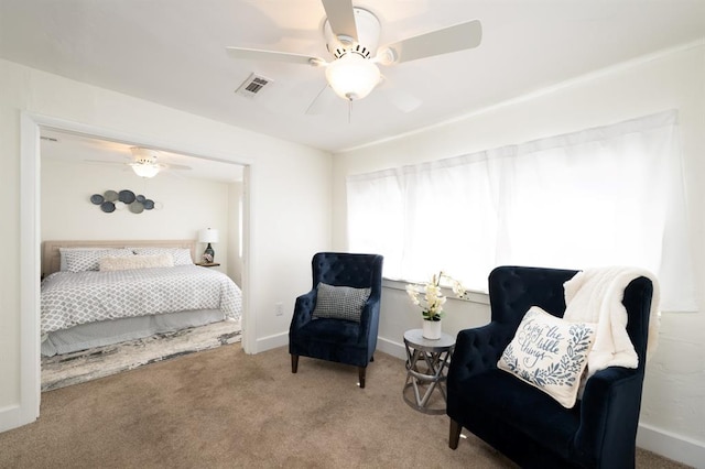 bedroom featuring baseboards, visible vents, carpet floors, and ceiling fan