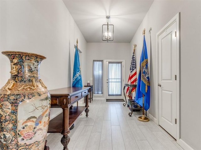 foyer entrance featuring baseboards