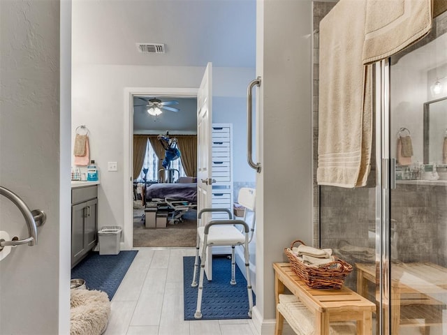 ensuite bathroom featuring vanity, visible vents, ensuite bath, a tile shower, and ceiling fan