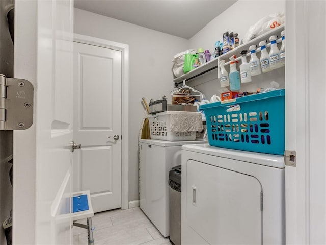 clothes washing area featuring laundry area and separate washer and dryer