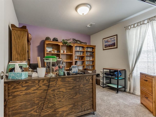 office space featuring light colored carpet and visible vents