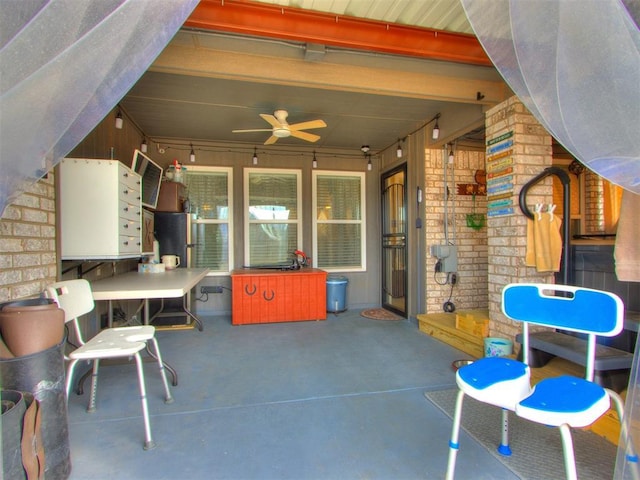 view of patio featuring ceiling fan