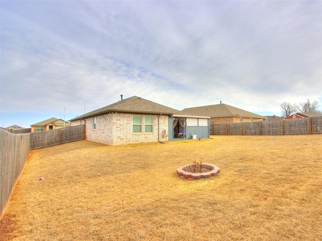 view of yard with an outbuilding and a fenced backyard