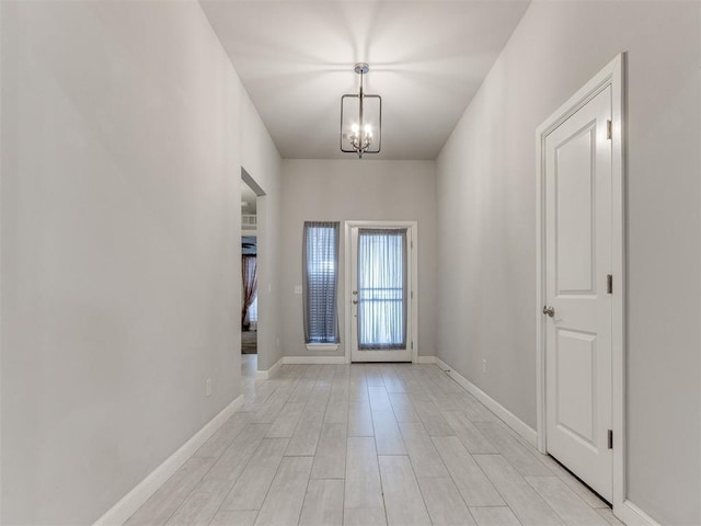 294 Emmy Jean Dr, Blanchard, OK 73010 - entryway with a chandelier, light wood finished floors, and baseboards