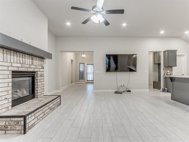 294 Emmy Jean Dr, Blanchard, OK 73010 - unfurnished living room with baseboards, recessed lighting, light wood-style floors, a ceiling fan, and a brick fireplace