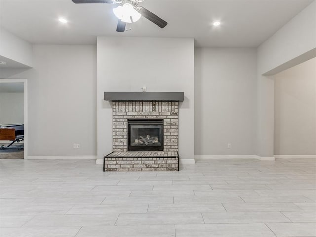 294 Emmy Jean Dr, Blanchard, OK 73010 - unfurnished living room with ceiling fan, baseboards, a brick fireplace, and recessed lighting