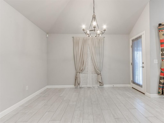 294 Emmy Jean Dr, Blanchard, OK 73010 - unfurnished room with lofted ceiling, baseboards, light wood-style floors, and a chandelier