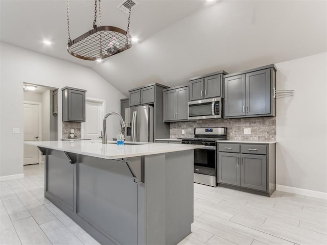 294 Emmy Jean Dr, Blanchard, OK 73010 - kitchen with lofted ceiling, visible vents, appliances with stainless steel finishes, and gray cabinets