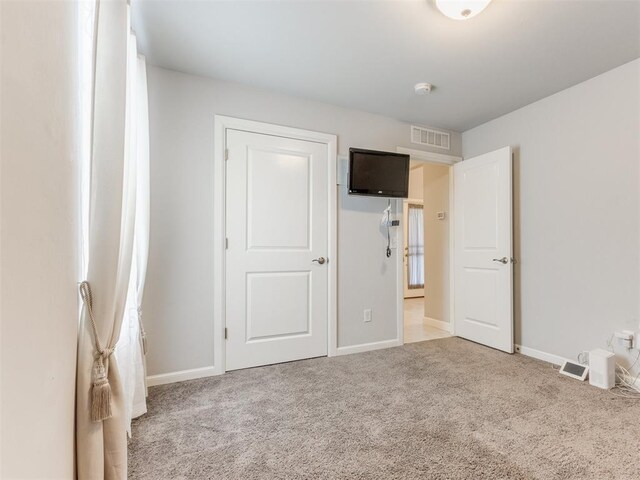 294 Emmy Jean Dr, Blanchard, OK 73010 - unfurnished bedroom with baseboards, visible vents, and carpet