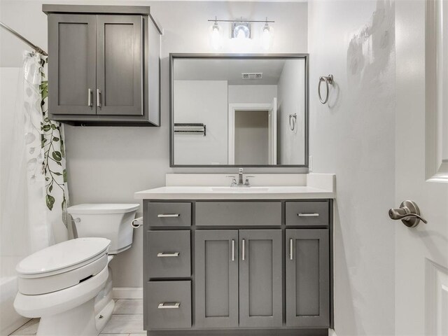 294 Emmy Jean Dr, Blanchard, OK 73010 - full bath with curtained shower, visible vents, toilet, vanity, and baseboards