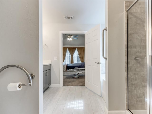 294 Emmy Jean Dr, Blanchard, OK 73010 - ensuite bathroom featuring a shower with door, visible vents, a ceiling fan, vanity, and ensuite bathroom