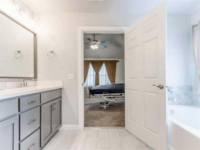 294 Emmy Jean Dr, Blanchard, OK 73010 - full bath featuring tile patterned floors, a ceiling fan, vanity, a bath, and baseboards