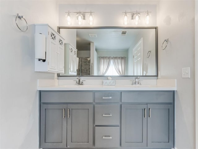 294 Emmy Jean Dr, Blanchard, OK 73010 - bathroom featuring visible vents, a sink, double vanity, and an enclosed shower