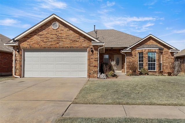 ranch-style home featuring brick siding, an attached garage, concrete driveway, and a front yard