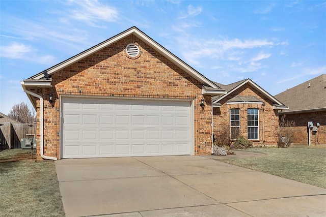 ranch-style house featuring brick siding, an attached garage, concrete driveway, and a front yard