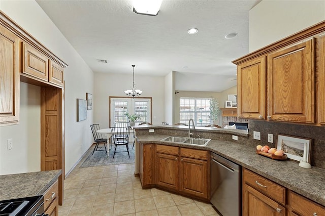 kitchen with a sink, stainless steel dishwasher, dark countertops, and brown cabinetry