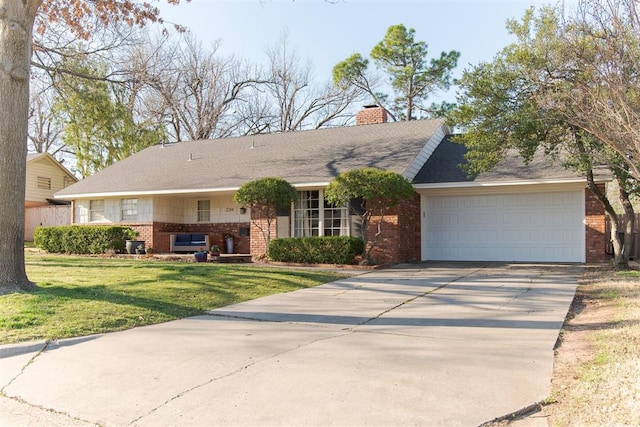 ranch-style house featuring a front lawn, brick siding, driveway, and a chimney