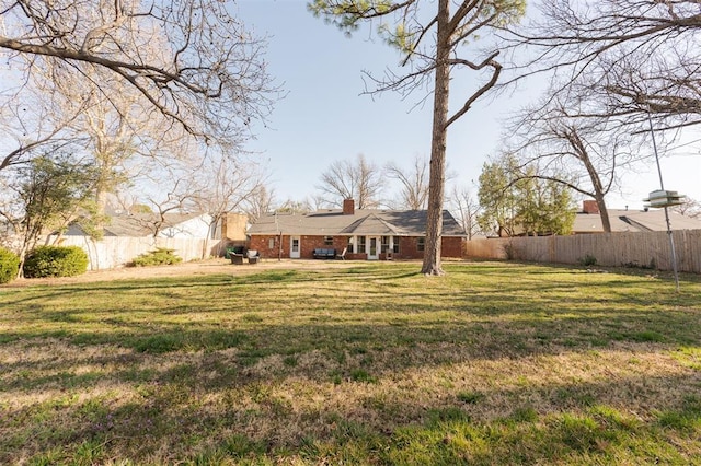 view of yard featuring a fenced backyard